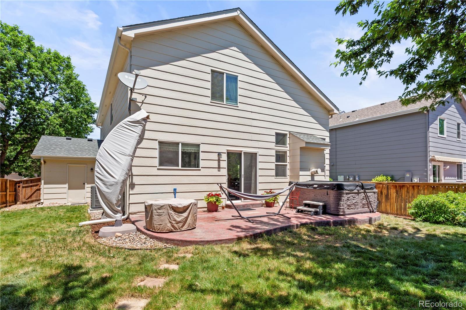 2212 Hyacinth Road Littleton, CO 80129 - Photo 43 of 44 a view of a house with backyard and sitting area