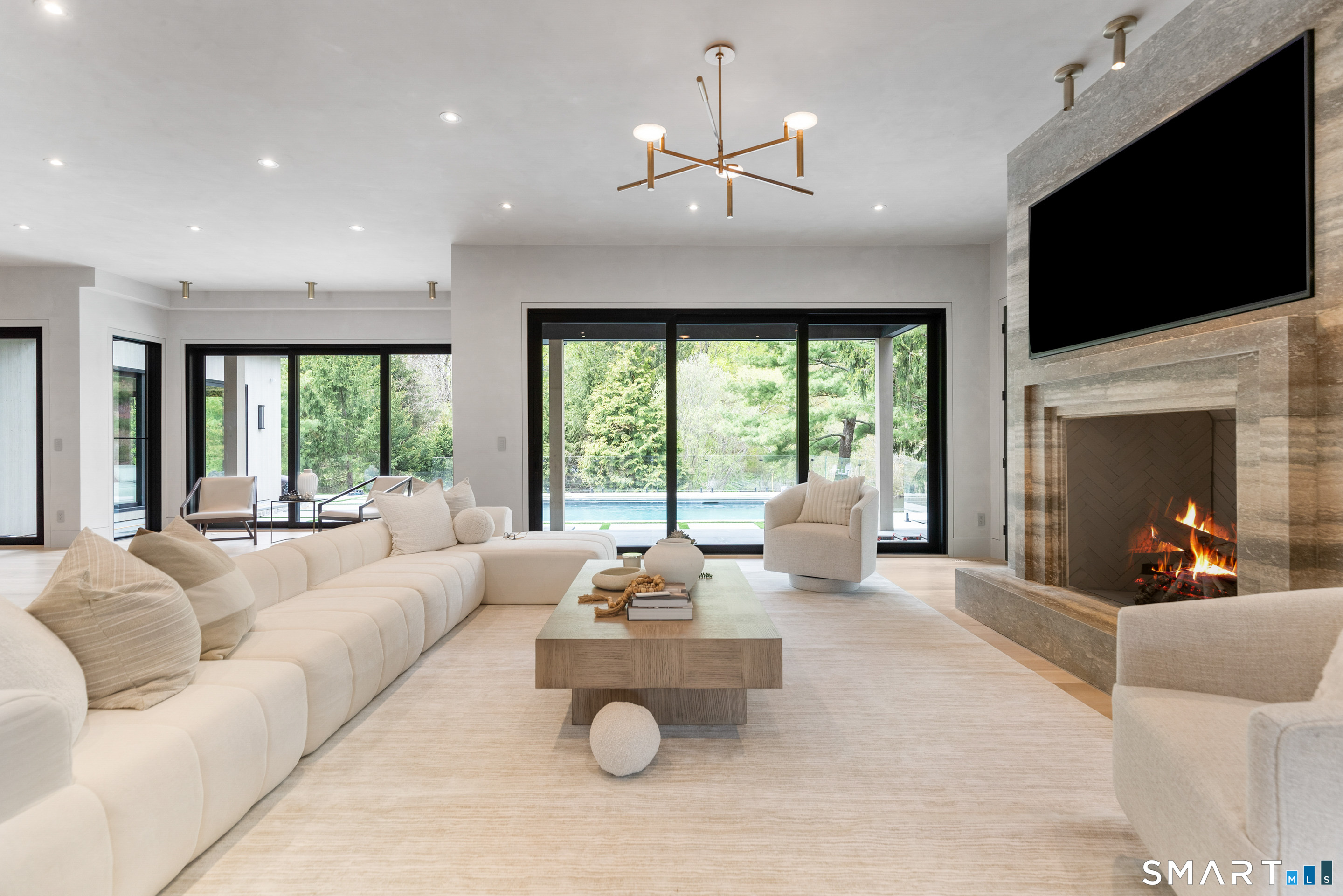259 Frogtown Road New Canaan, CT 06840 - Photo 13 of 39 Family room with full access to the pool