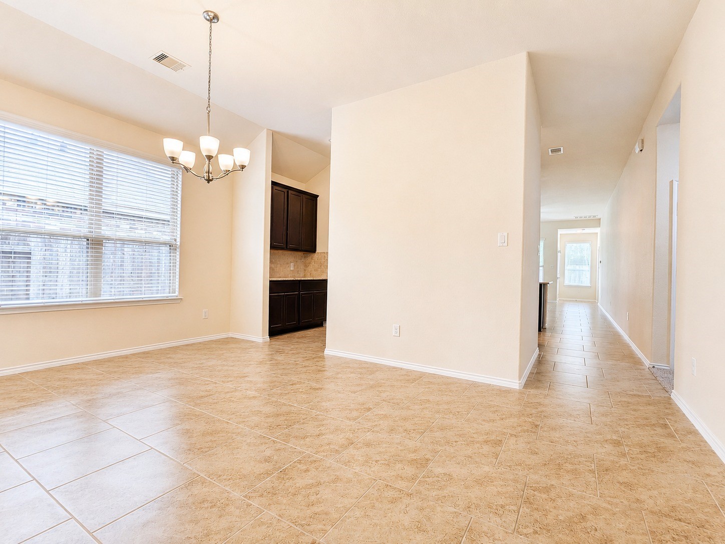 24315 Ravenna Landing Loop Spring, TX 77389 - Photo 8 of 37 a view of a room with wooden floor and a ceiling fan