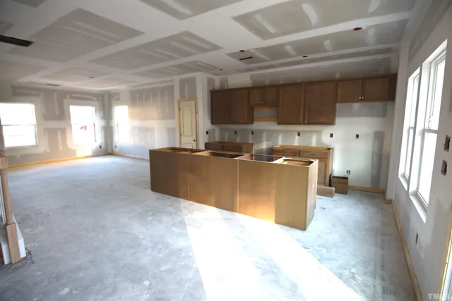 a kitchen with cabinets and window