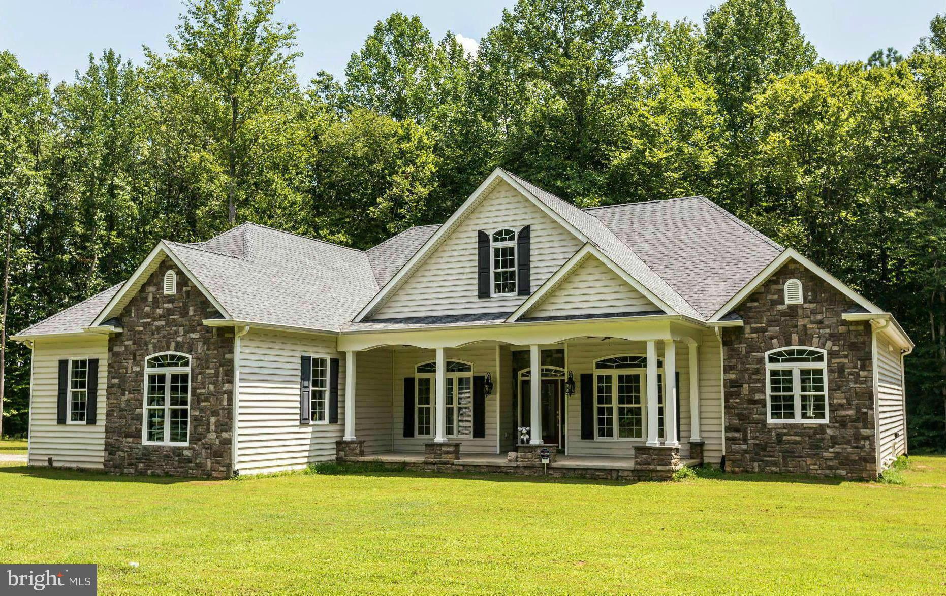 19385 Country Road Beaverdam, VA 23015 - Photo 1 of 30 a front view of a house with a yard