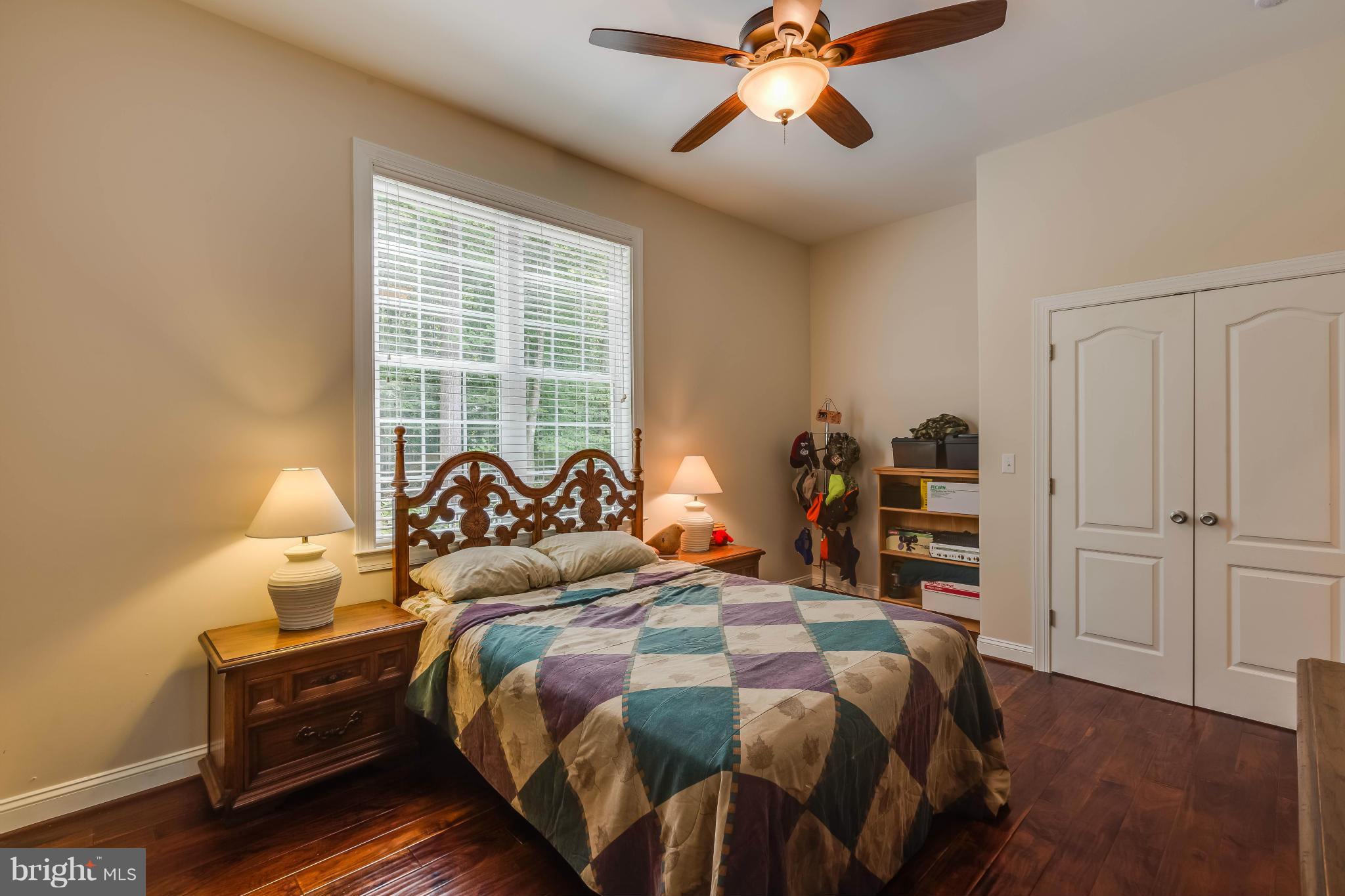 19385 Country Road Beaverdam, VA 23015 - Photo 15 of 30 a bedroom with a bed and a chandelier