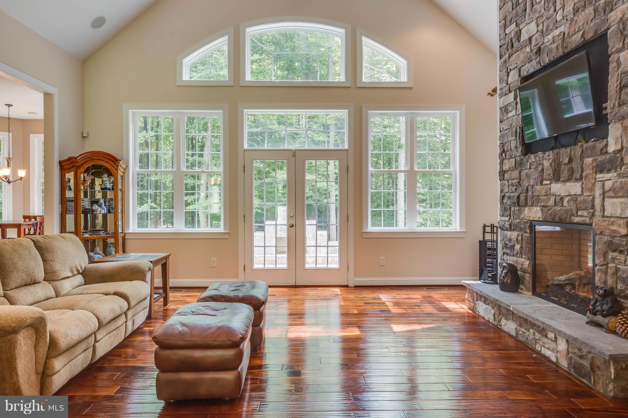 19385 Country Road Beaverdam, VA 23015 - Photo 2 of 30 a living room with fireplace furniture and a large window