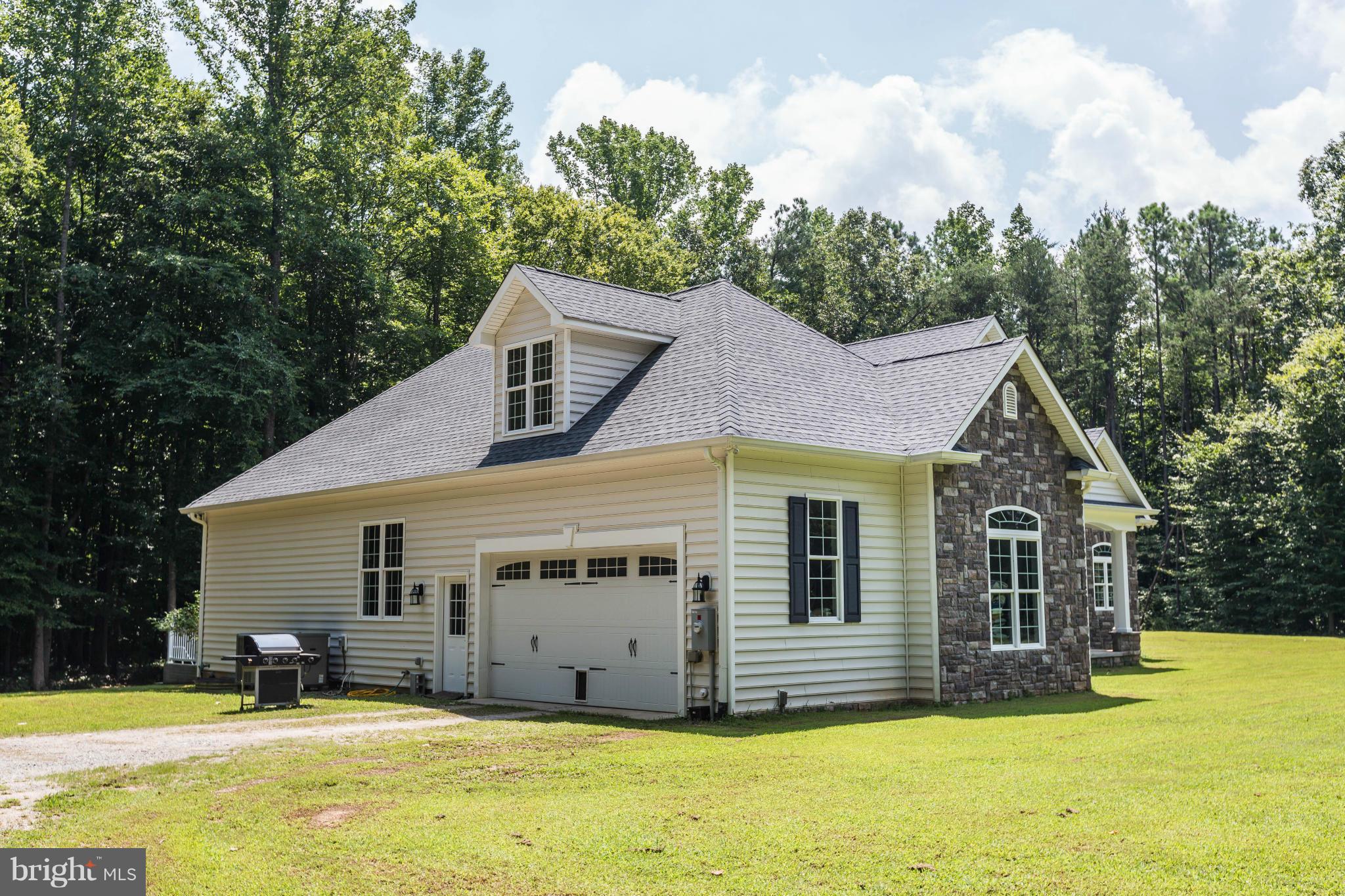 19385 Country Road Beaverdam, VA 23015 - Photo 25 of 30 a view of a house with a swimming pool and sitting area