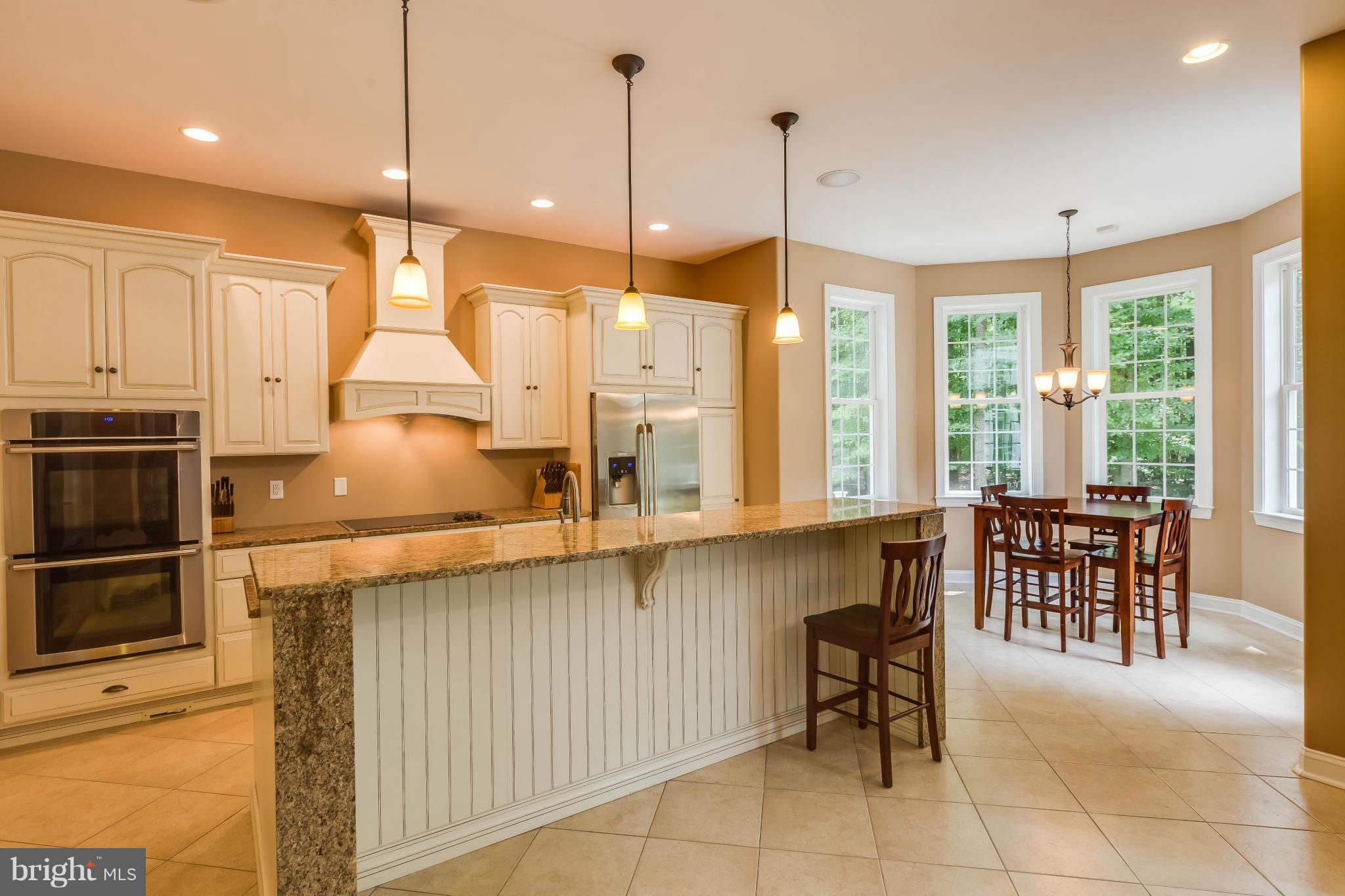 19385 Country Road Beaverdam, VA 23015 - Photo 3 of 30 a open kitchen with a sink a counter top space appliances and cabinets