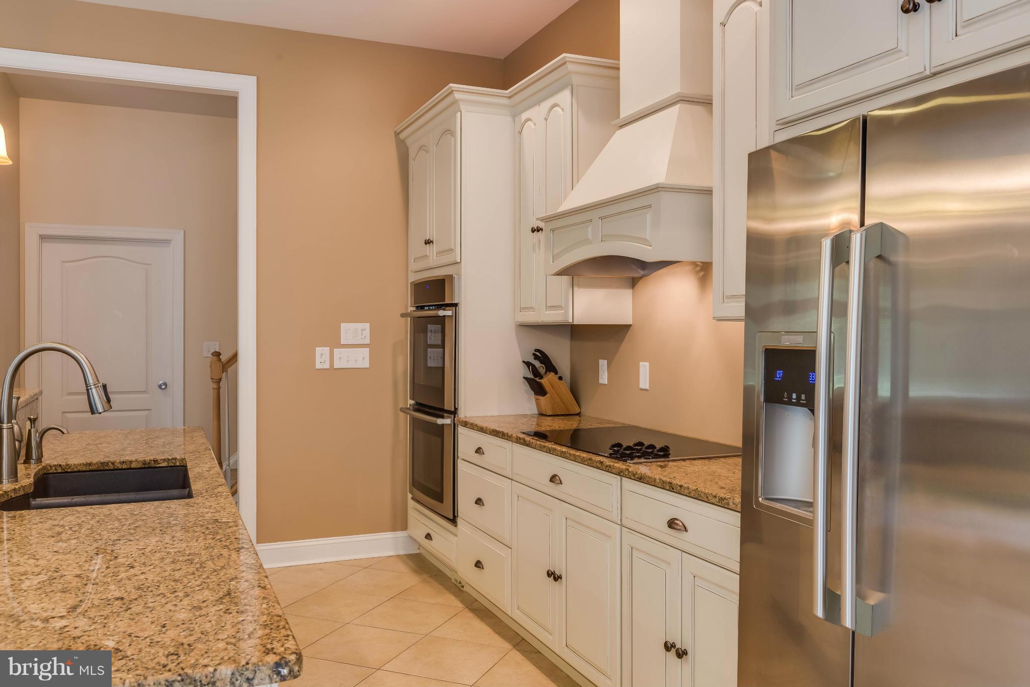 19385 Country Road Beaverdam, VA 23015 - Photo 6 of 30 a kitchen with stainless steel appliances granite countertop a refrigerator and a sink
