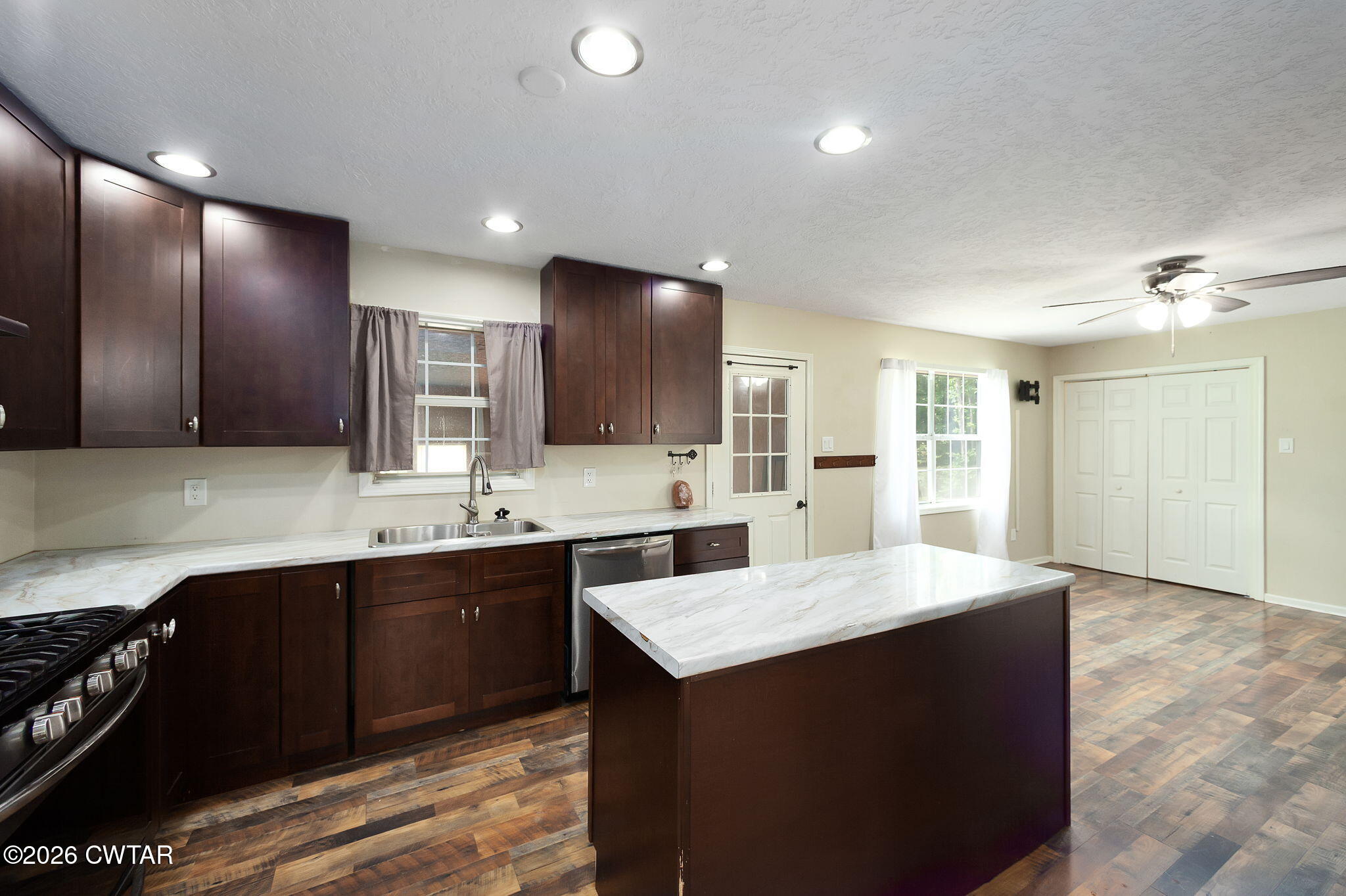 306 Jim Jackson Road Humboldt, TN 38343 - Photo 12 of 29 a large kitchen with a sink and cabinets