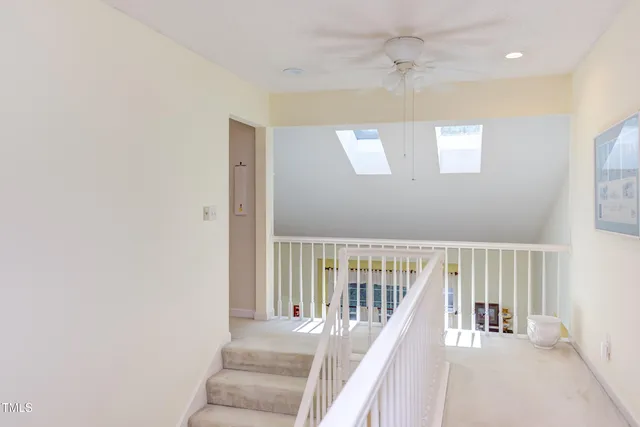 a view of a hallway with staircase