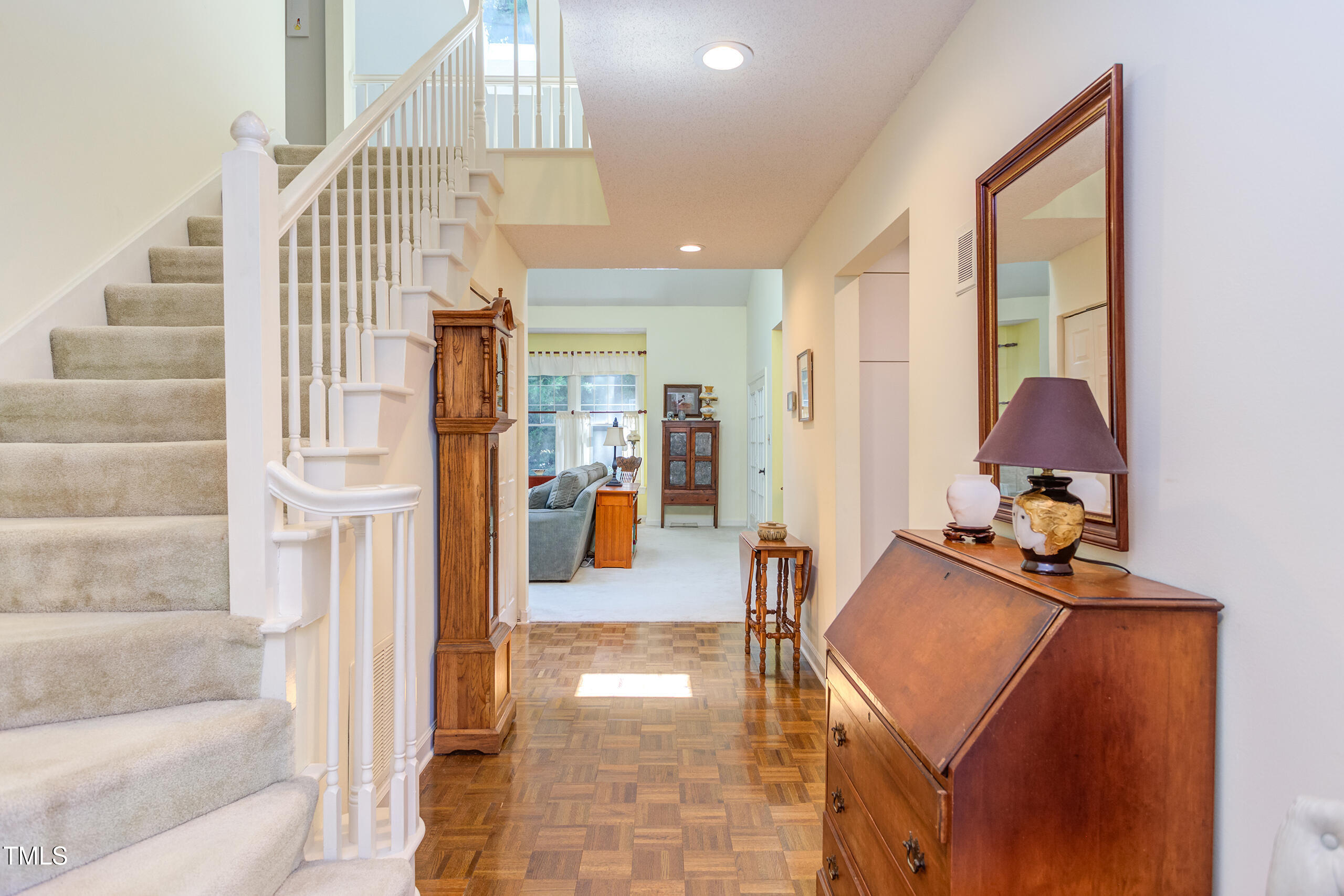 309 Baneberry Close Pittsboro, NC 27312 - Photo 2 of 43 a view of entryway and hall with wooden floor