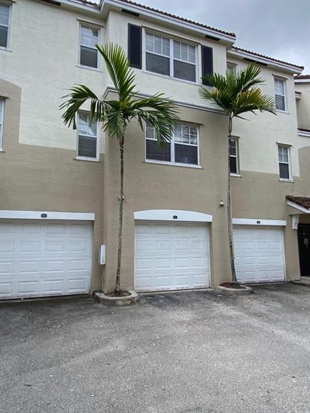 6020 West Sample Road, Unit 105 Coral Springs, FL 33067 - Photo 31 of 50 6020 W Sample Rd # 105 Coral Springs gar