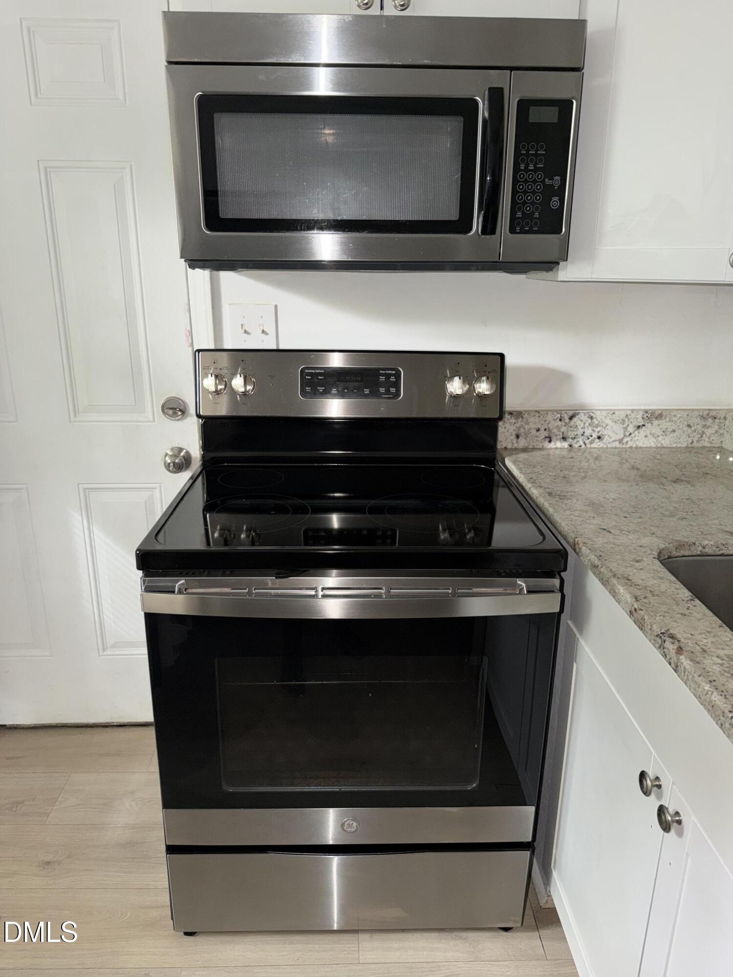 1107 Worth Street Durham, NC 27701 - Photo 13 of 17 a stove top oven sitting inside of a kitchen