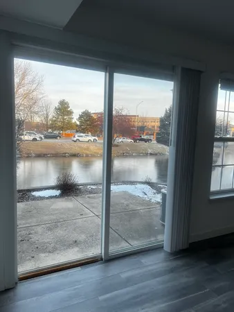 a view of a glass door and wooden floor