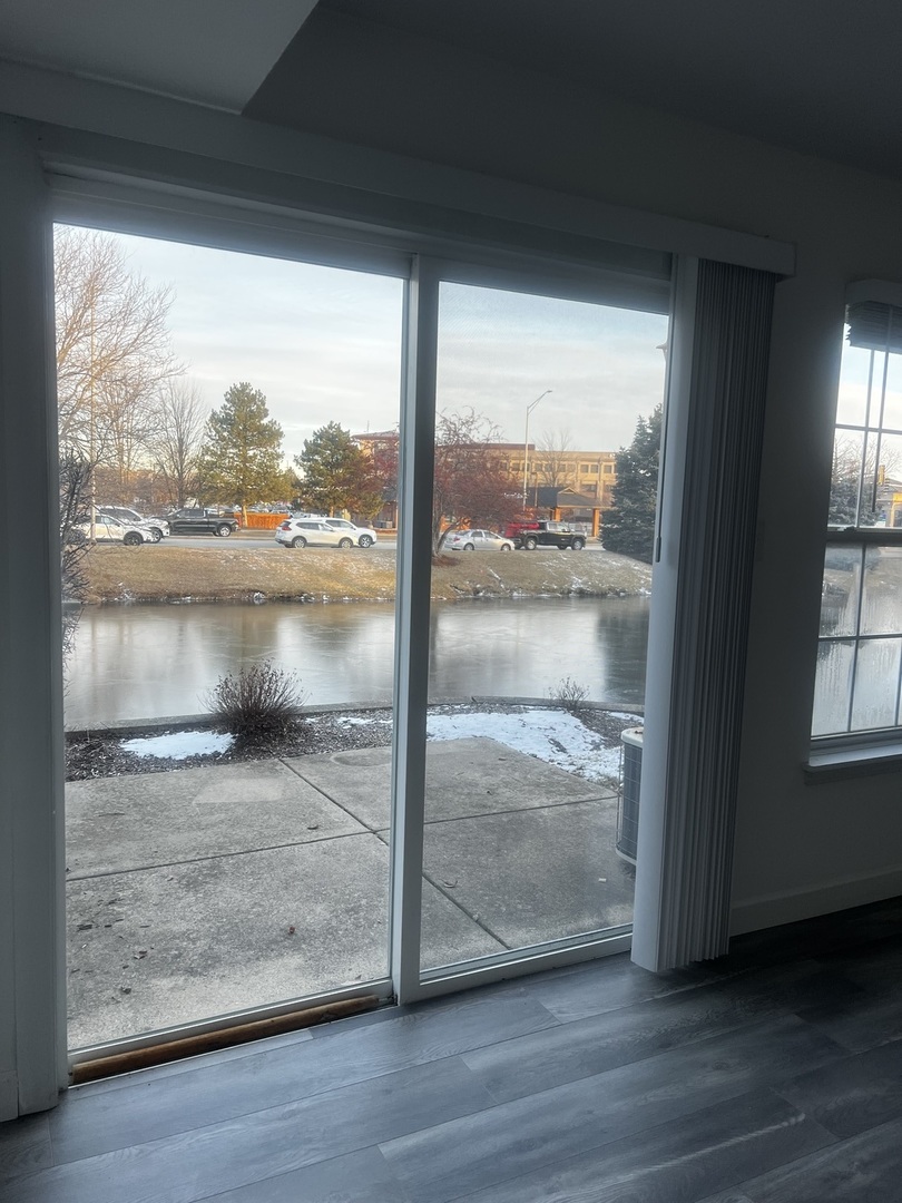 640 Beaver Court Naperville, IL 60563 - Photo 14 of 26 a view of a glass door and wooden floor