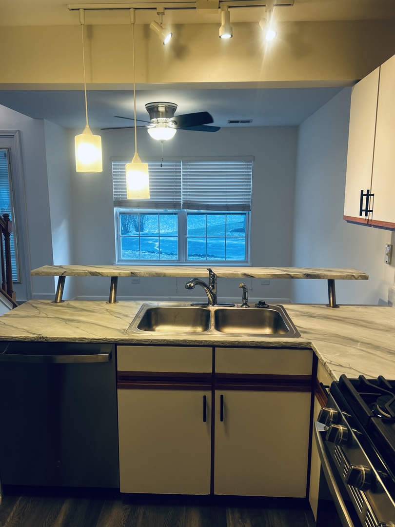 640 Beaver Court Naperville, IL 60563 - Photo 9 of 26 a bathroom with a sink and a mirror