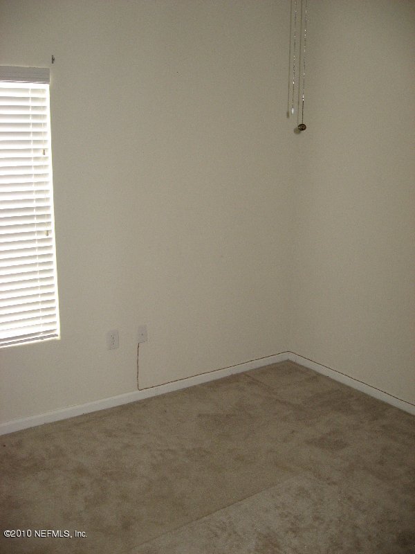 7920 Merrill Road, Unit 602 Jacksonville, FL 32277 - Photo 6 of 12 an empty room with a window