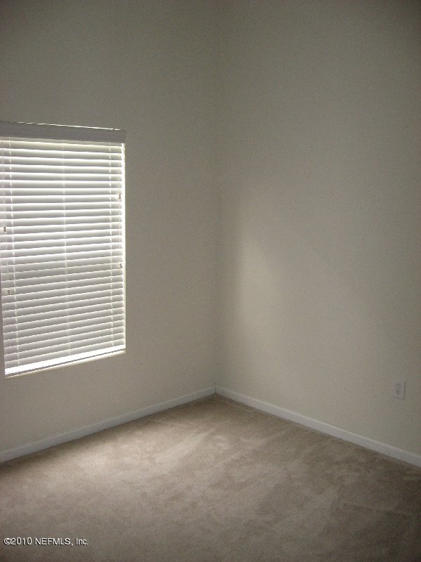7920 Merrill Road, Unit 602 Jacksonville, FL 32277 - Photo 8 of 12 an empty room with a window