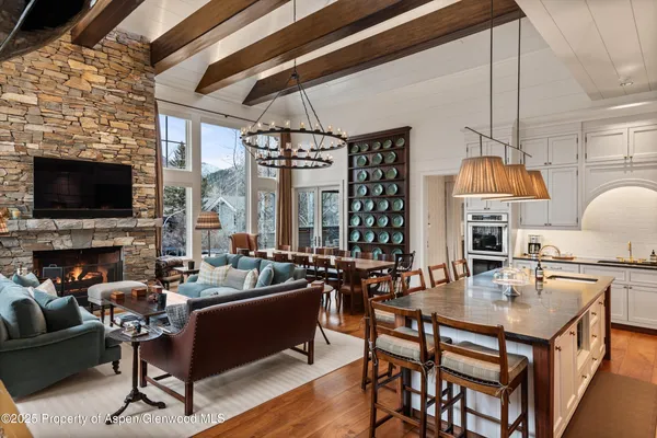 a bedroom with a bed a table and chair