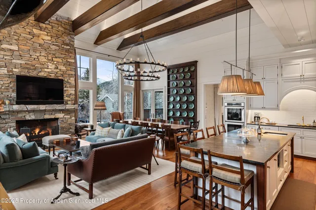 a bedroom with a bed a table and chair