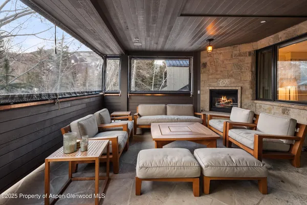 a view of a hallway with furniture and entryway