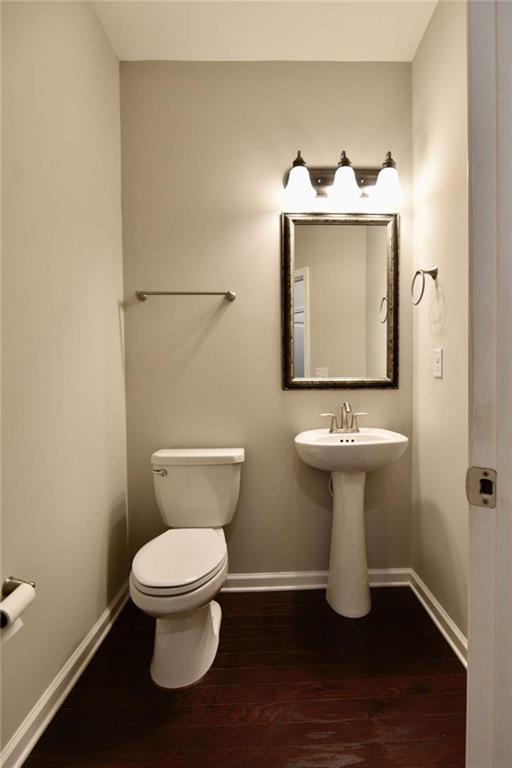 1223 Foxcroft Lane Cumming, GA 30041 - Photo 13 of 33 a bathroom with a toilet sink and mirror