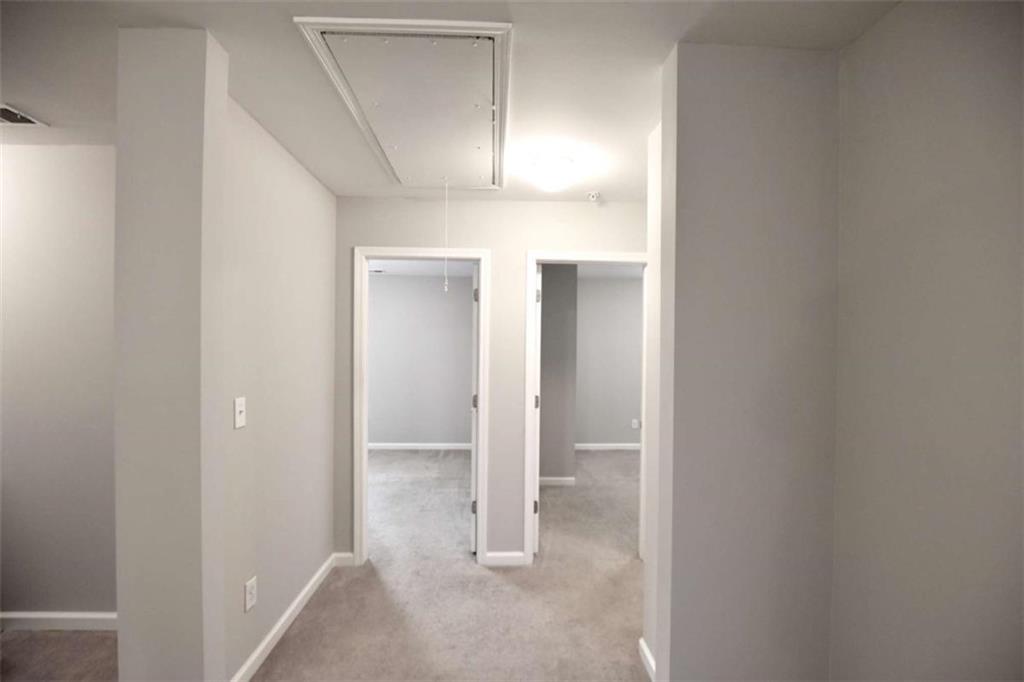 1223 Foxcroft Lane Cumming, GA 30041 - Photo 16 of 33 an empty room with wooden floor and windows