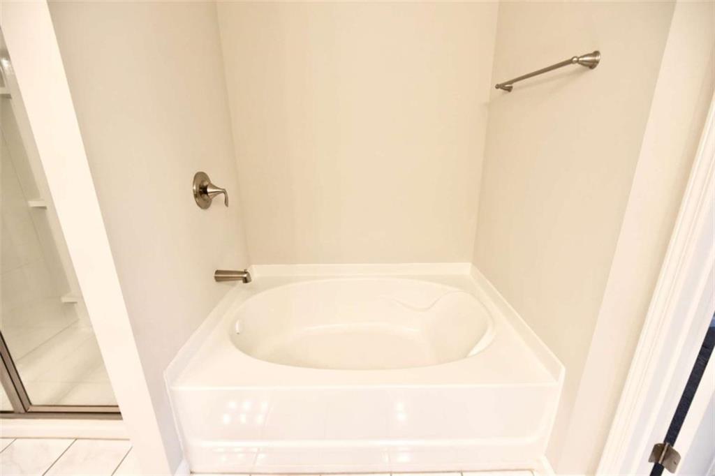 1223 Foxcroft Lane Cumming, GA 30041 - Photo 20 of 33 a bathroom with a tub