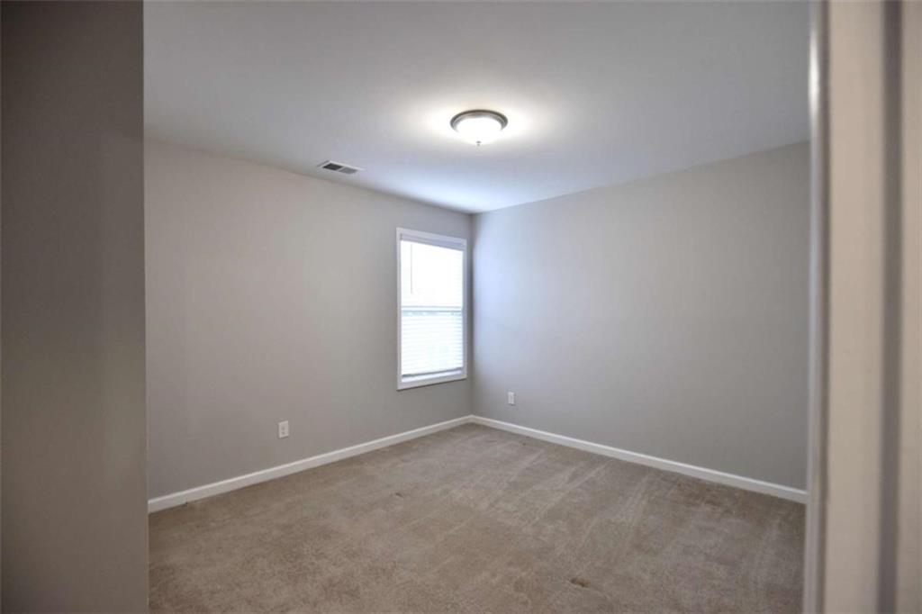 1223 Foxcroft Lane Cumming, GA 30041 - Photo 25 of 33 a view of empty room with window