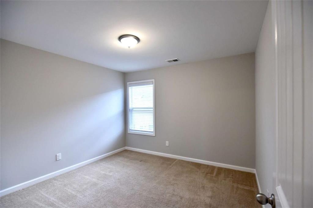 1223 Foxcroft Lane Cumming, GA 30041 - Photo 26 of 33 an empty room with a window