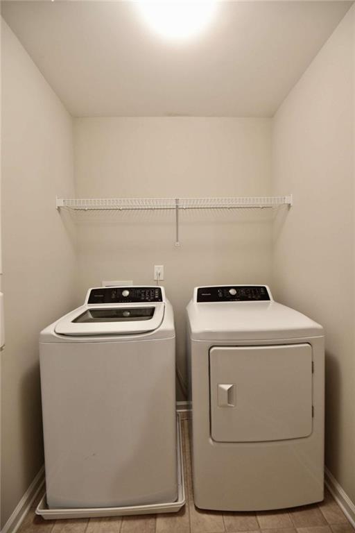 1223 Foxcroft Lane Cumming, GA 30041 - Photo 30 of 33 a utility room with dryer and washer