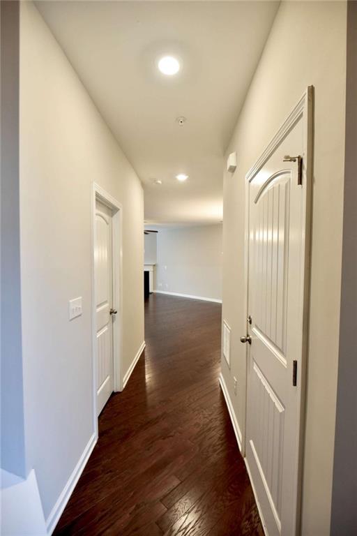 1223 Foxcroft Lane Cumming, GA 30041 - Photo 4 of 33 a view of a hallway with wooden floor