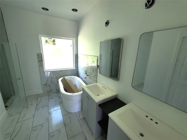 a bathroom with a sink and mirror