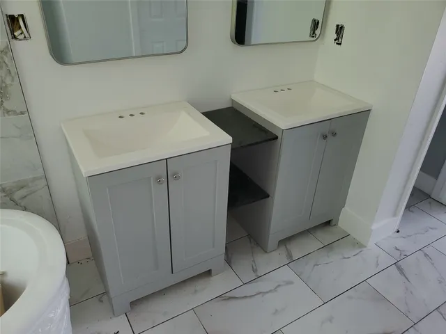 a utility room with cabinets