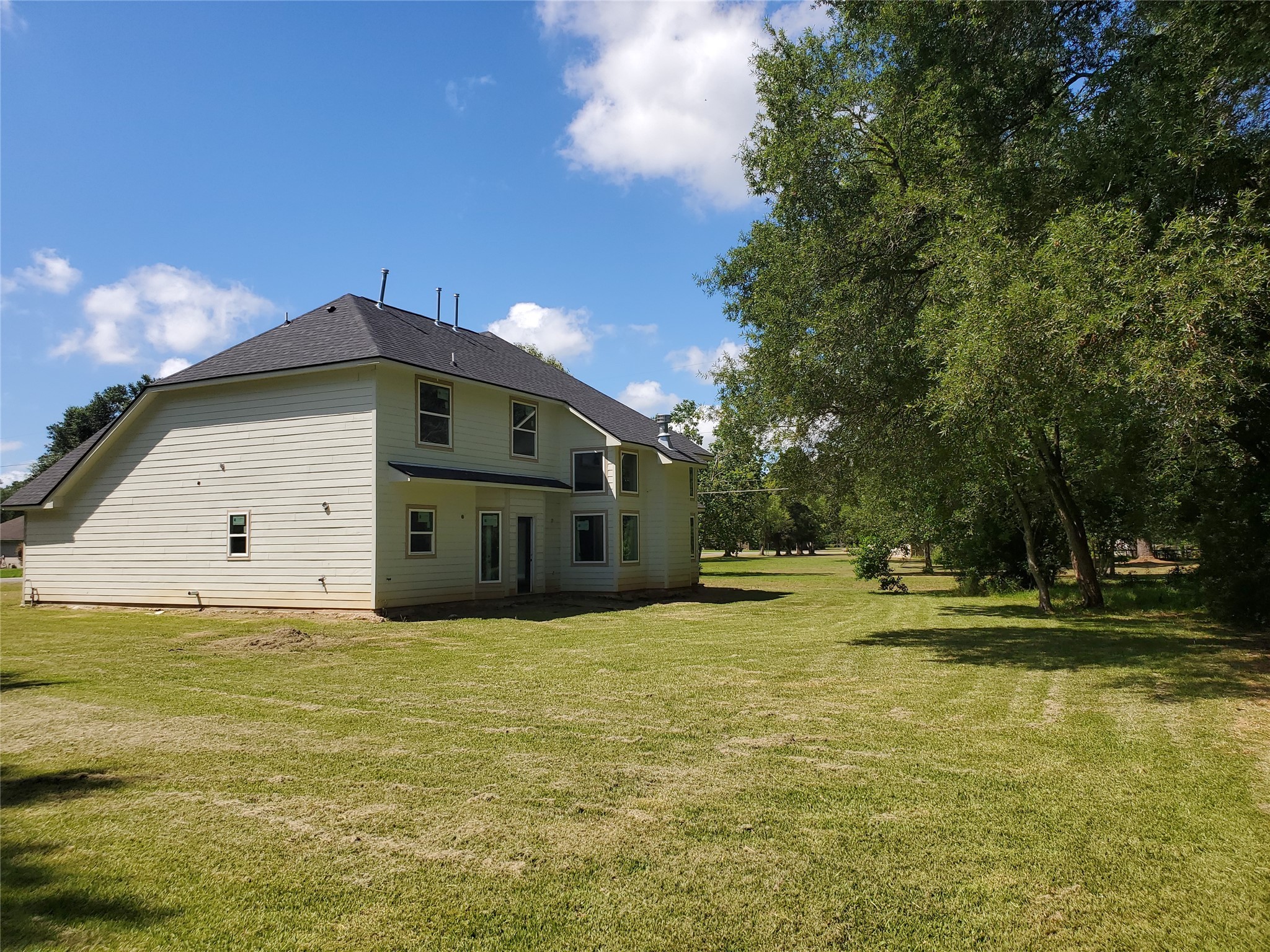 6985 Ellen Lane Beaumont, TX 77708 - Photo 27 of 34 a large pool that has lawn chairs under an umbrella