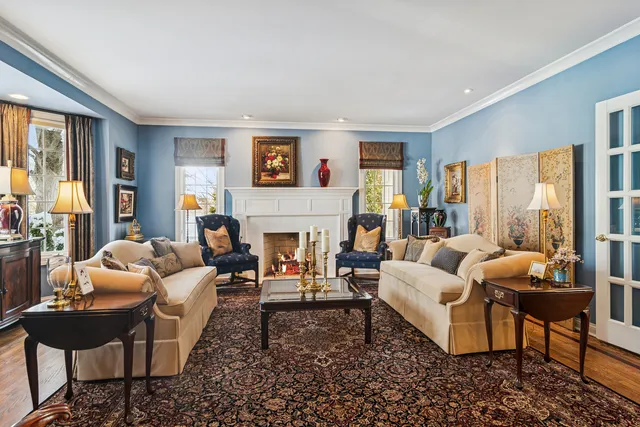 a kitchen with stainless steel appliances granite countertop a sink a stove and a wooden floors
