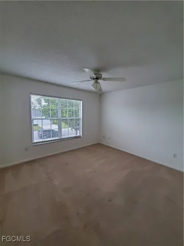 an empty room with a empty space and windows