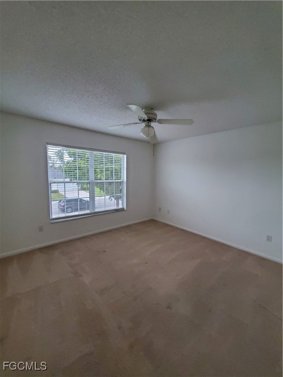 1304 South Brandywine Circle, Unit 3 Fort Myers, FL 33919 - Photo 12 of 29 an empty room with a empty space and windows