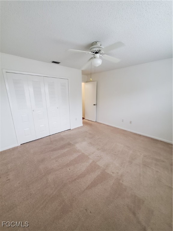 1304 South Brandywine Circle, Unit 3 Fort Myers, FL 33919 - Photo 14 of 29 a view of an empty room with a ceiling fan