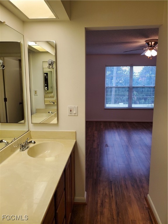 1304 South Brandywine Circle, Unit 3 Fort Myers, FL 33919 - Photo 21 of 29 a bathroom with a sink and a large mirror