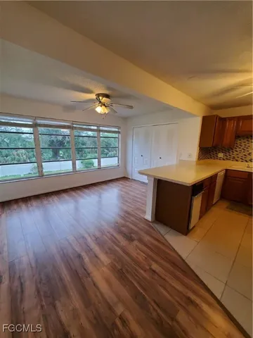 a view of kitchen and wooden floor
