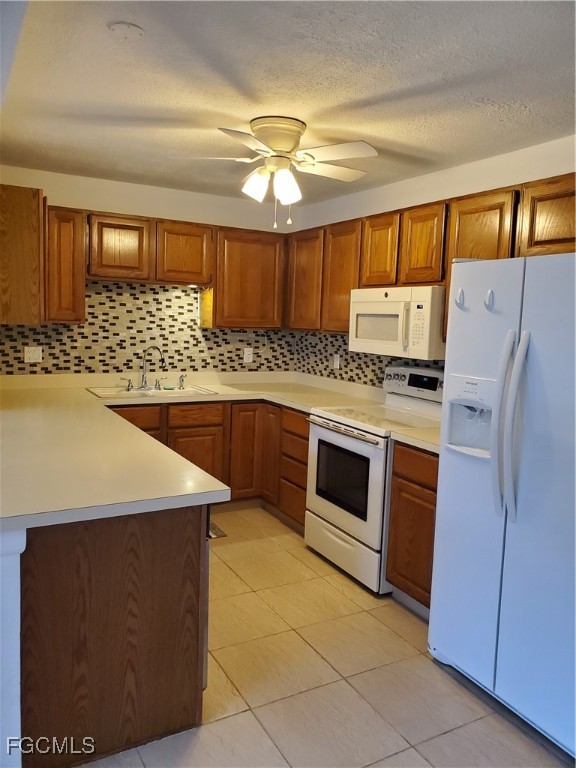 1304 South Brandywine Circle, Unit 3 Fort Myers, FL 33919 - Photo 5 of 29 a kitchen with stainless steel appliances a stove a microwave and a refrigerator