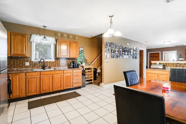 a bedroom with a bed window and a flat screen television