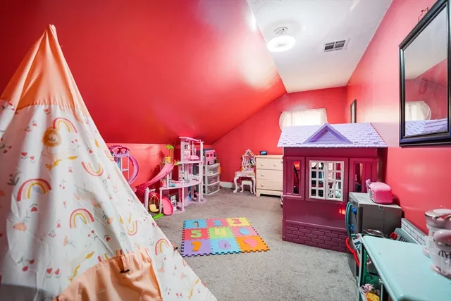 a bed room with a bed and a lamp