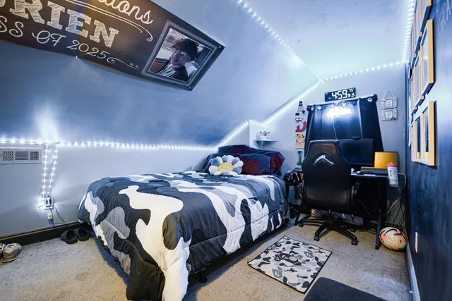 a bedroom with a bed and a table in it