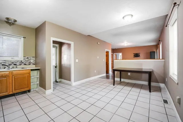 a kitchen with stainless steel appliances a refrigerator sink and stove