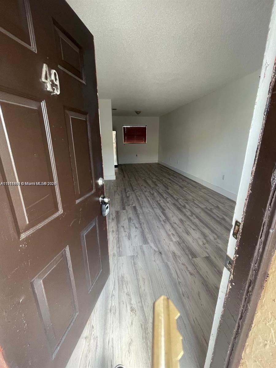 5491 West 24th Avenue, Unit 49 Hialeah, FL 33016 - Photo 1 of 7 a view of a hallway