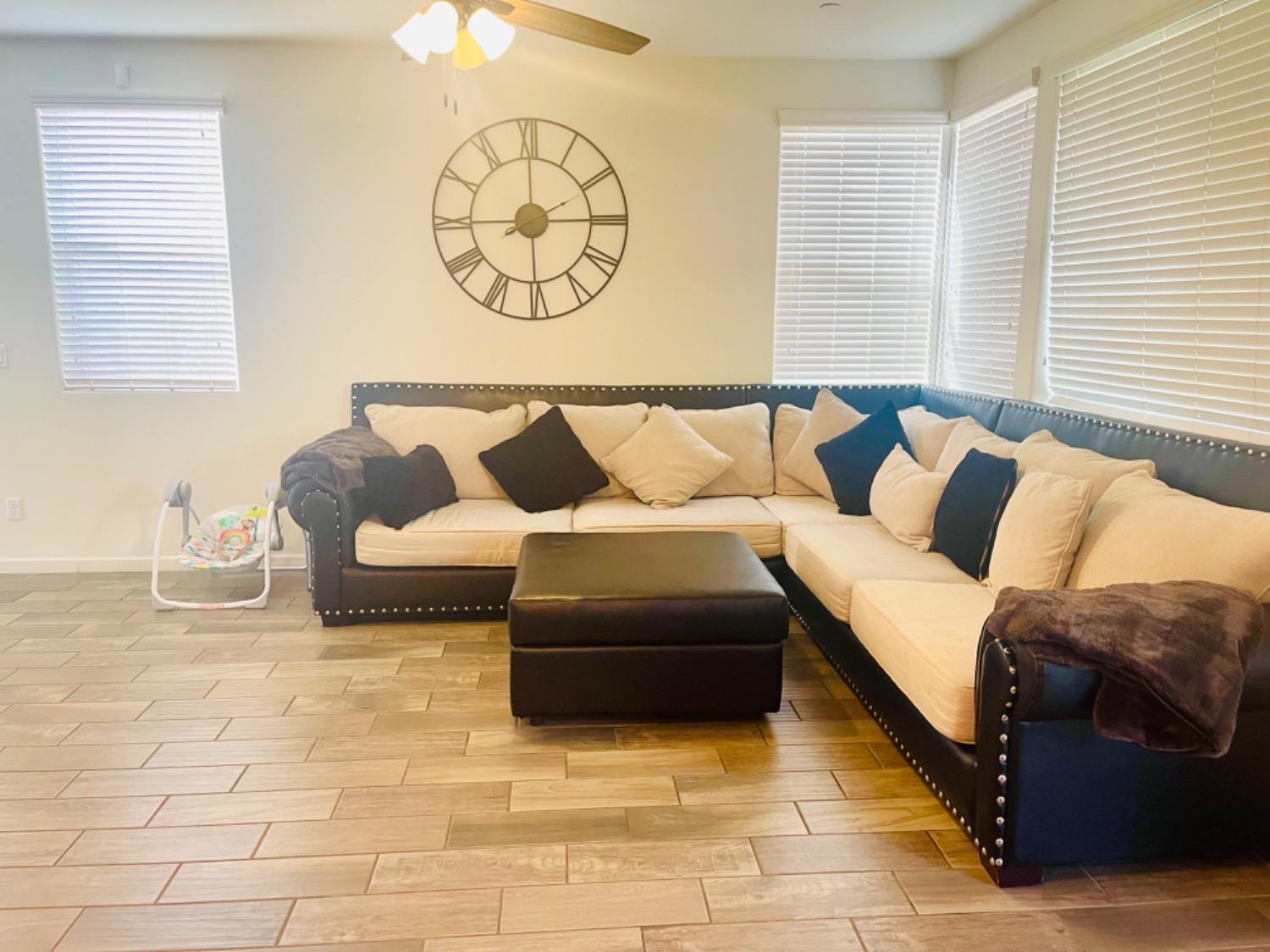 3727 Highclere Way Clovis, CA 93619 - Photo 11 of 25 a living room with furniture and a rug