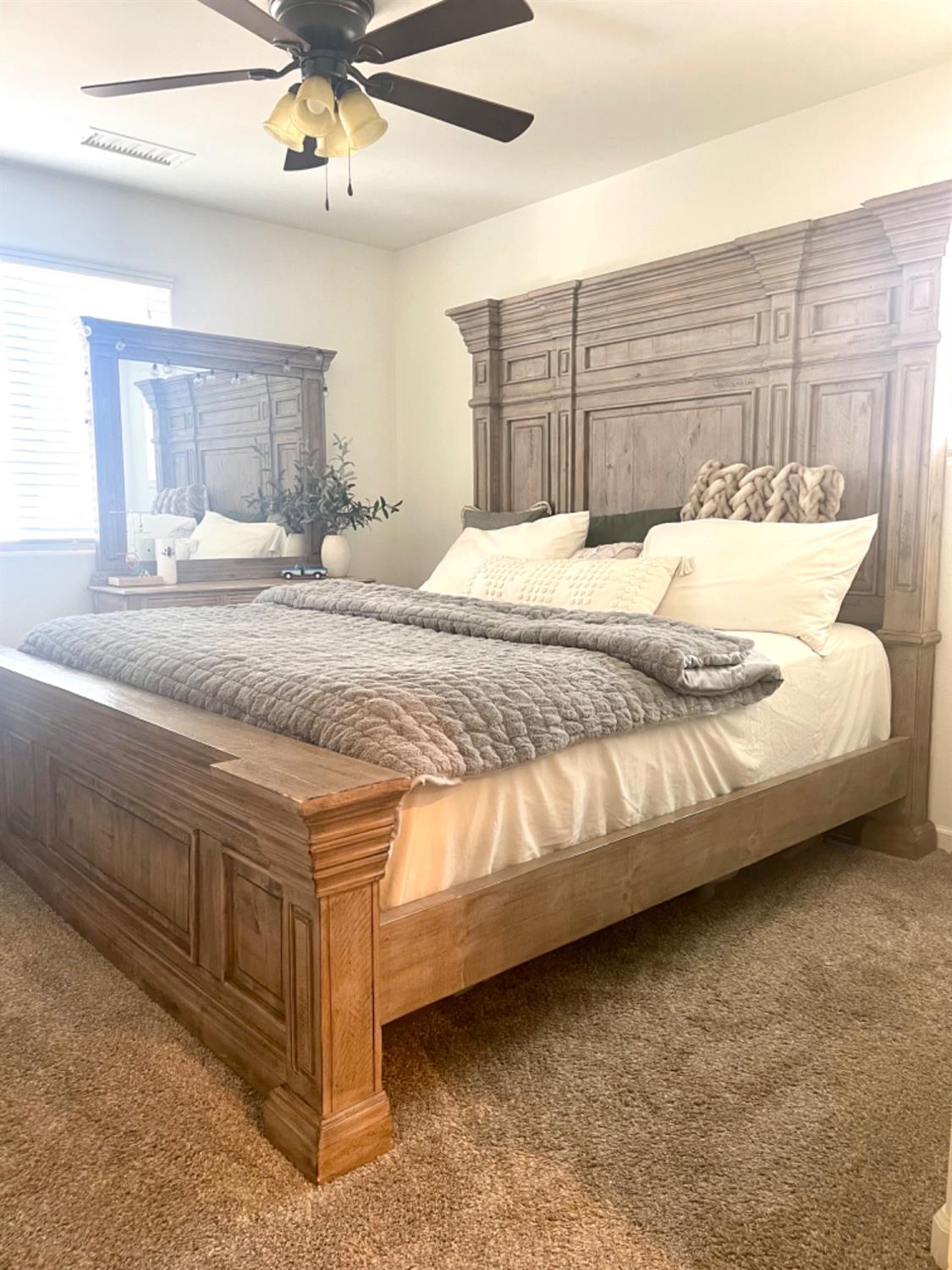 3727 Highclere Way Clovis, CA 93619 - Photo 15 of 25 a bedroom with a bed and ceiling fan