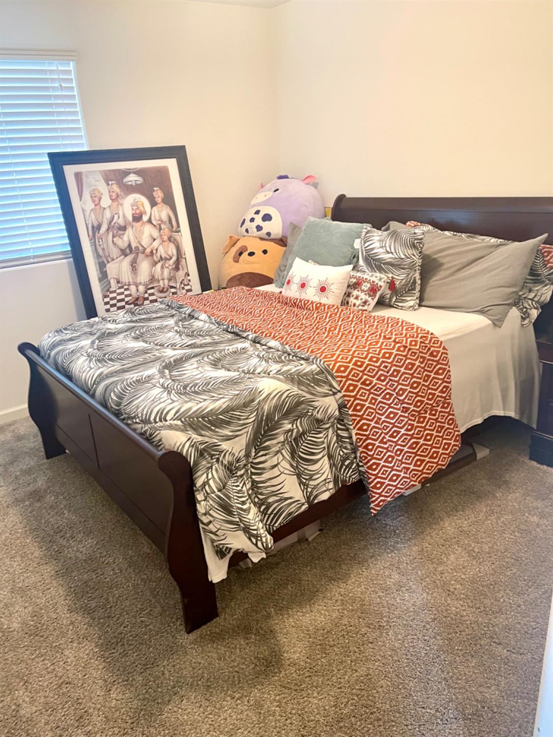 3727 Highclere Way Clovis, CA 93619 - Photo 17 of 25 a bed sitting in a bedroom next to a window