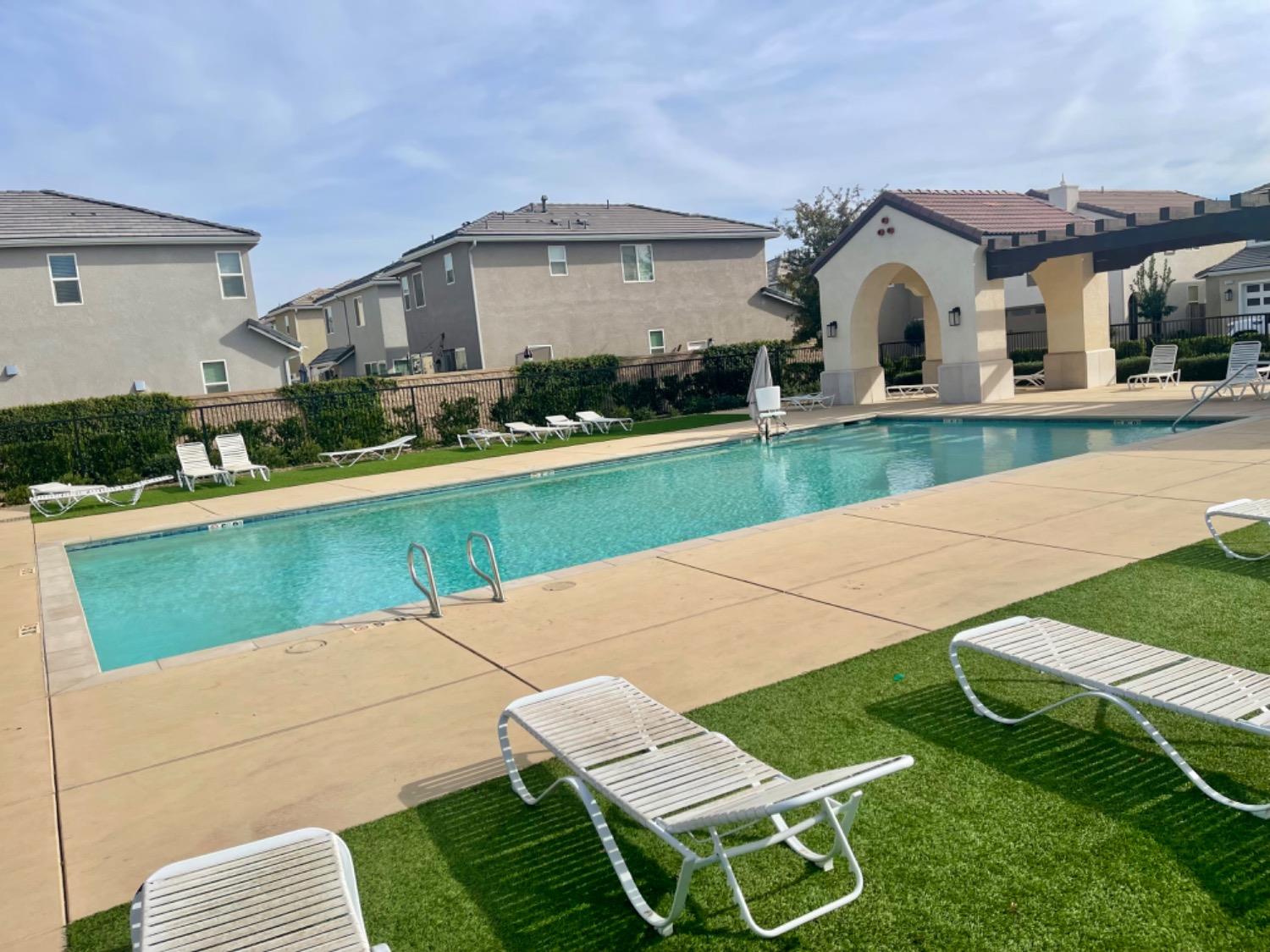 3727 Highclere Way Clovis, CA 93619 - Photo 25 of 25 a view of house with outdoor space and swimming pool