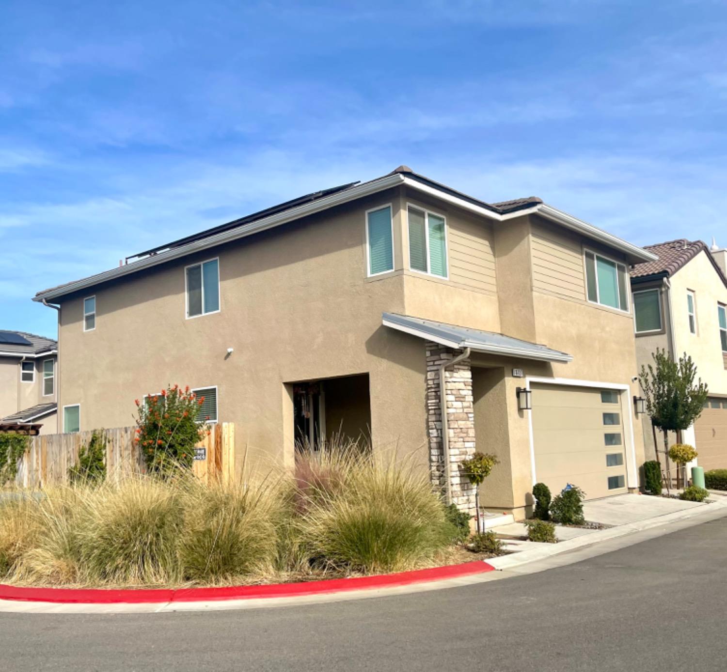 3727 Highclere Way Clovis, CA 93619 - Photo 3 of 25 a front view of a house with garage